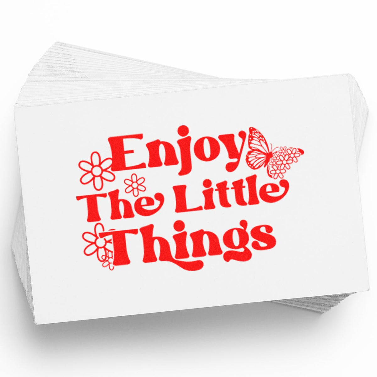 Stack of white stamp and seal cards with red Enjoy The Little Things text, flowers, and butterfly design.