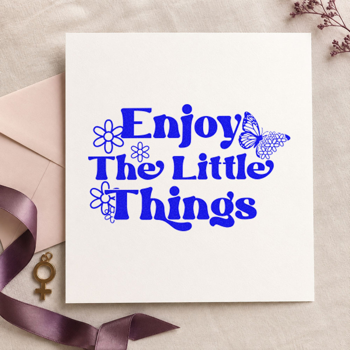 Enjoy The Little Things craft stamp imprinted in blue ink on paper, a design suited to framed counter back.