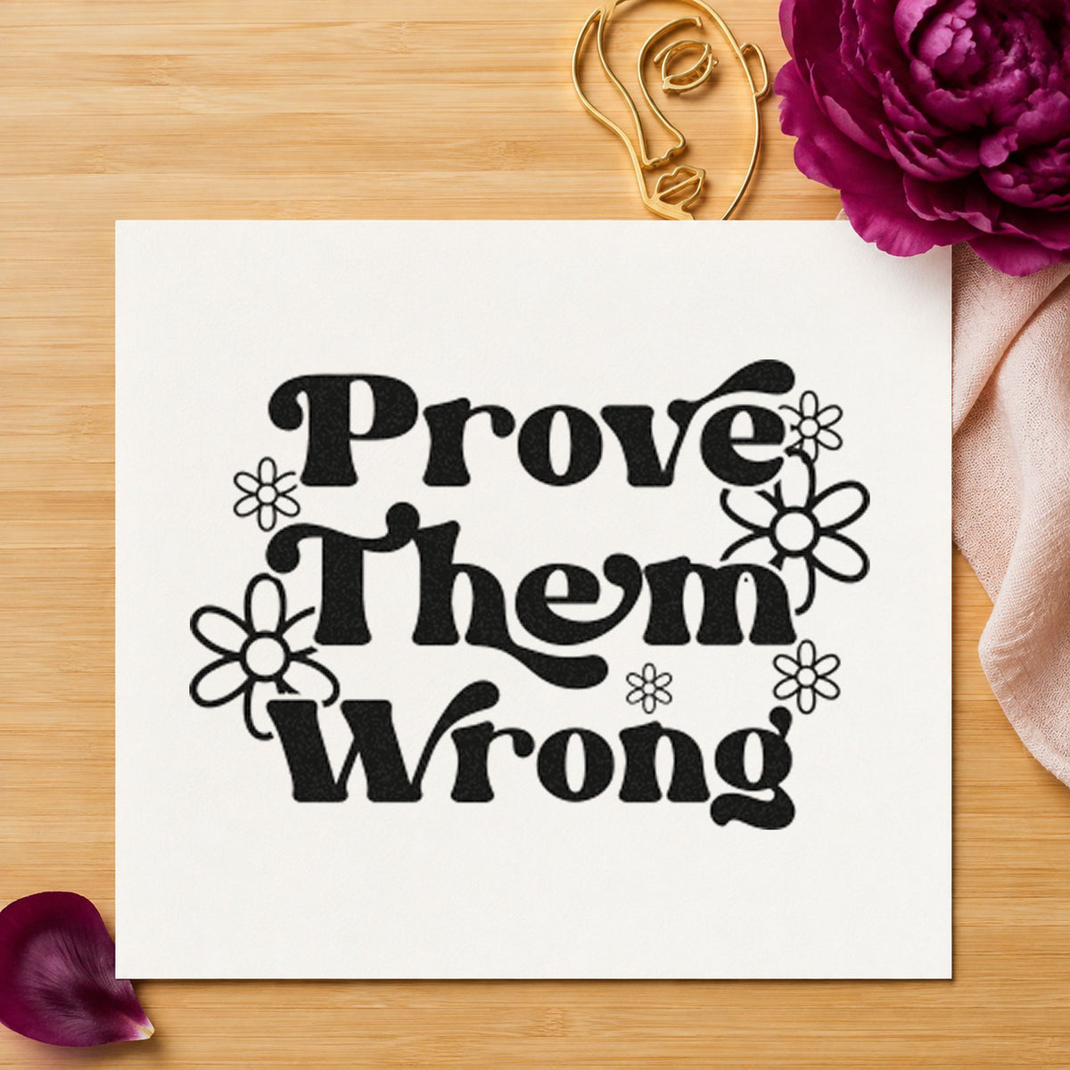 Prove Them Wrong Flowers craft stamp imprint in black ink on a handmade project, one idea being text book gift tags.