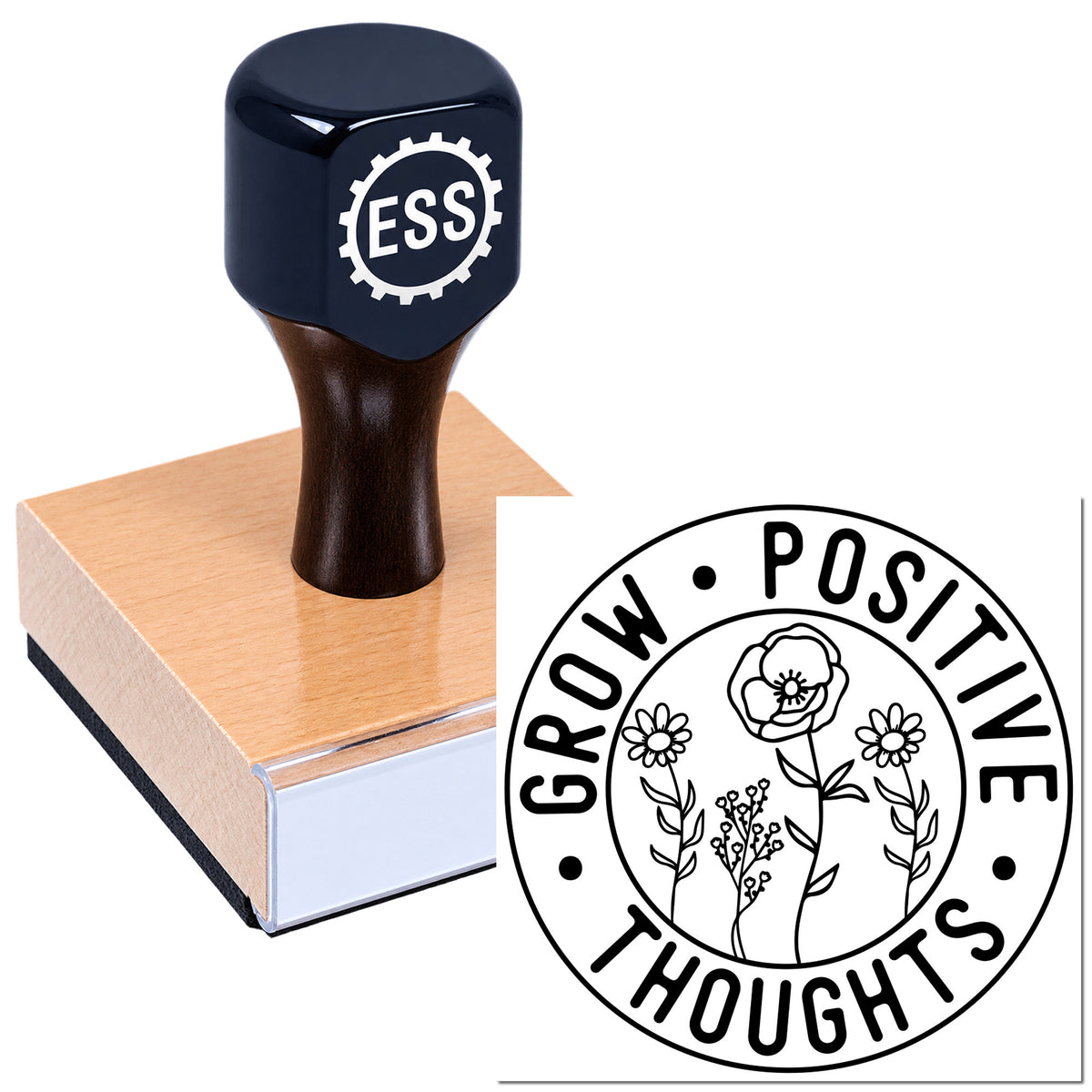 Dark navy ESS rubber stamp on copper wood base beside floral seal reading "Grow Positive Thoughts."
