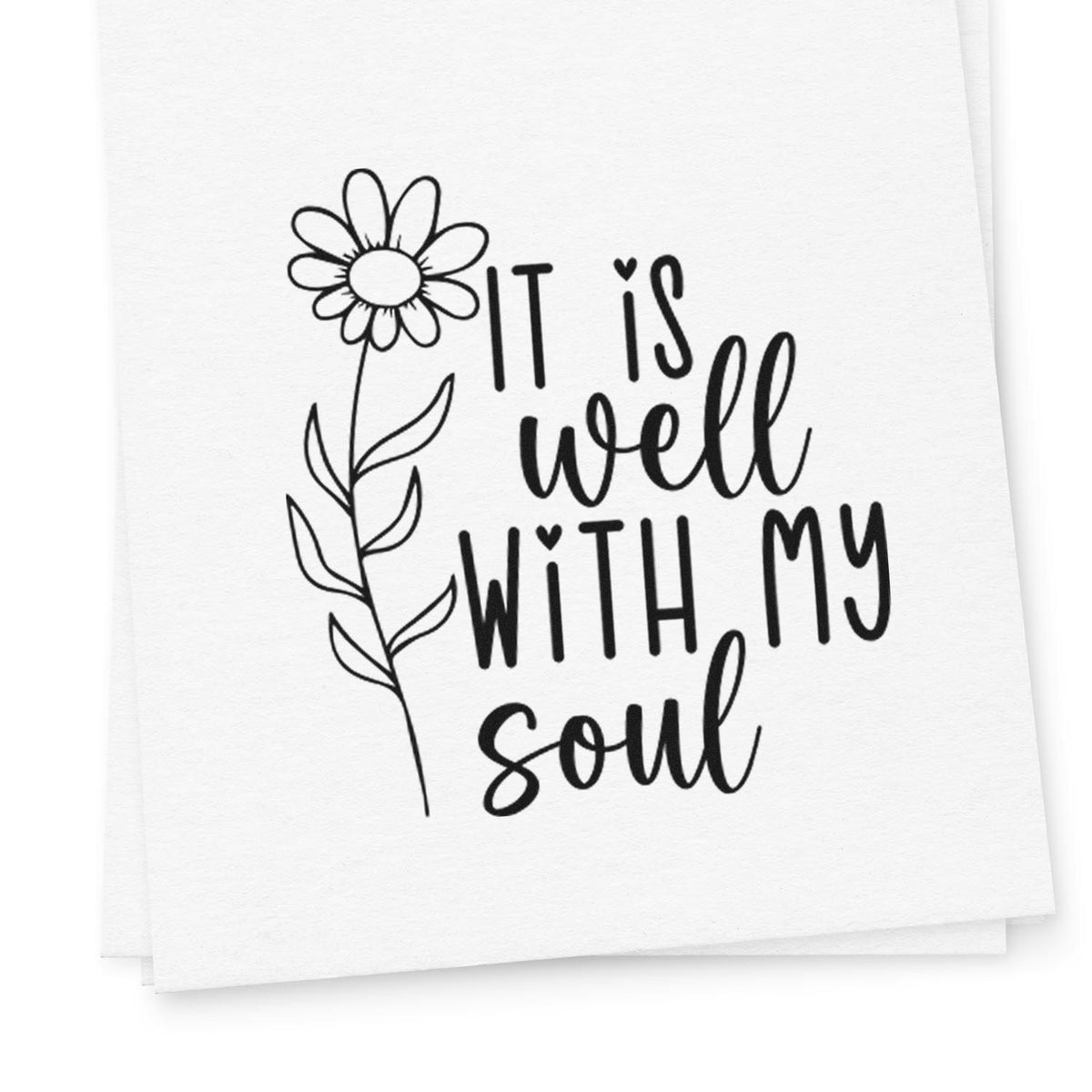 Black floral stamp seal with daisy and handwritten quote, It is well with my soul, on white paper.