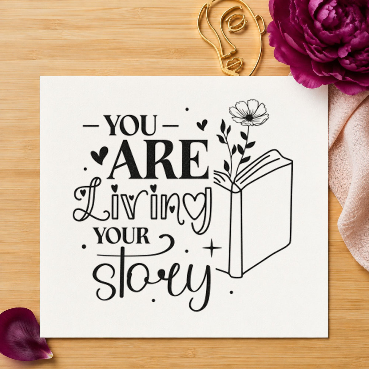 You Are Living Story craft stamp imprint in black ink on a handmade project, one idea being chapter gift tags.