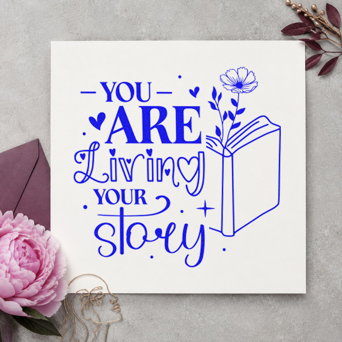 You Are Living Story craft stamp in blue ink on cardstock, an easy option for notebook sleeve printing.
