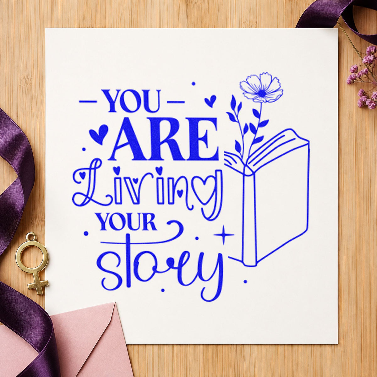 You Are Living Story craft stamp imprinted in blue ink on paper, a design suited to framed writing room.