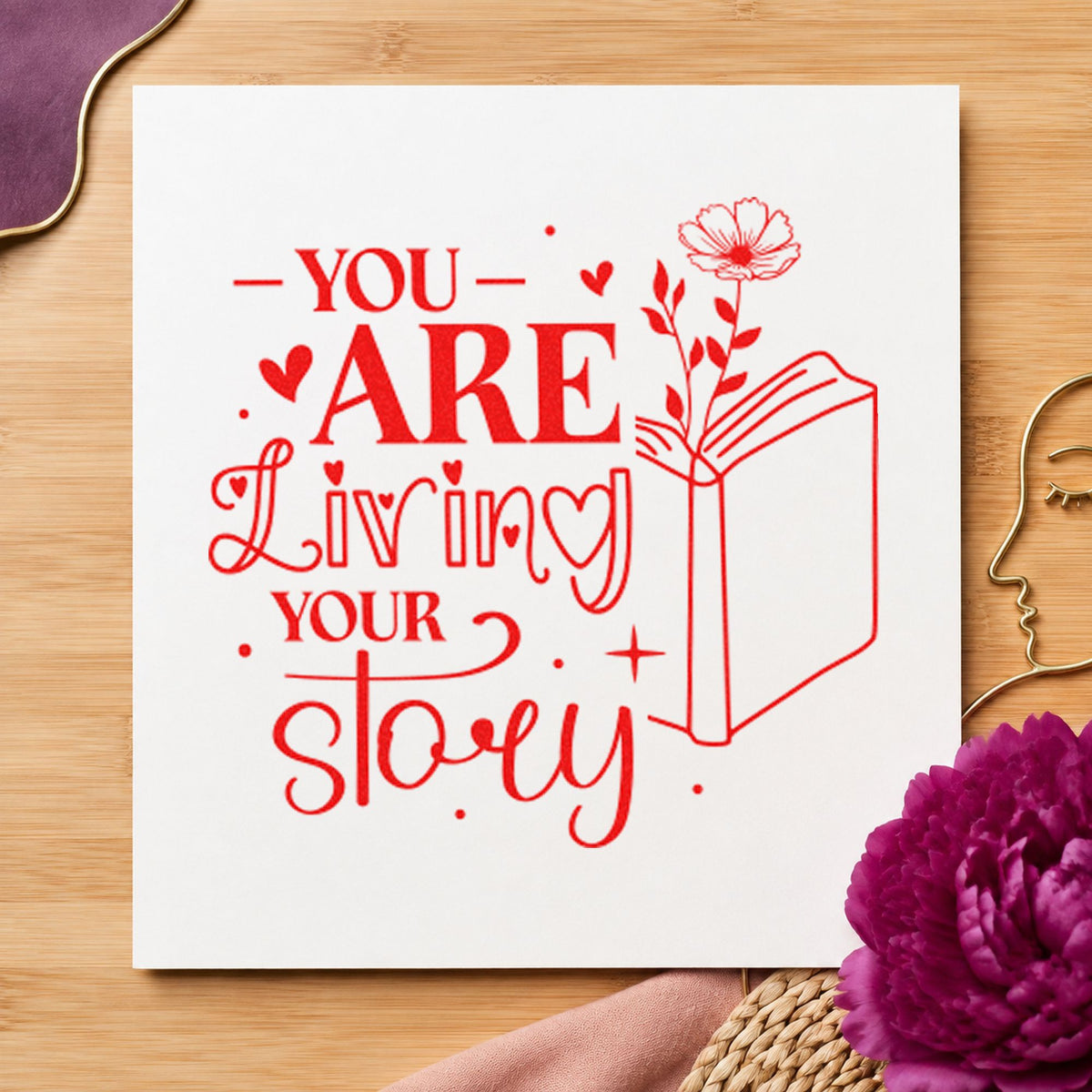 You Are Living Story craft stamp imprint in red ink on a handmade project, one idea being memory prompt cards.