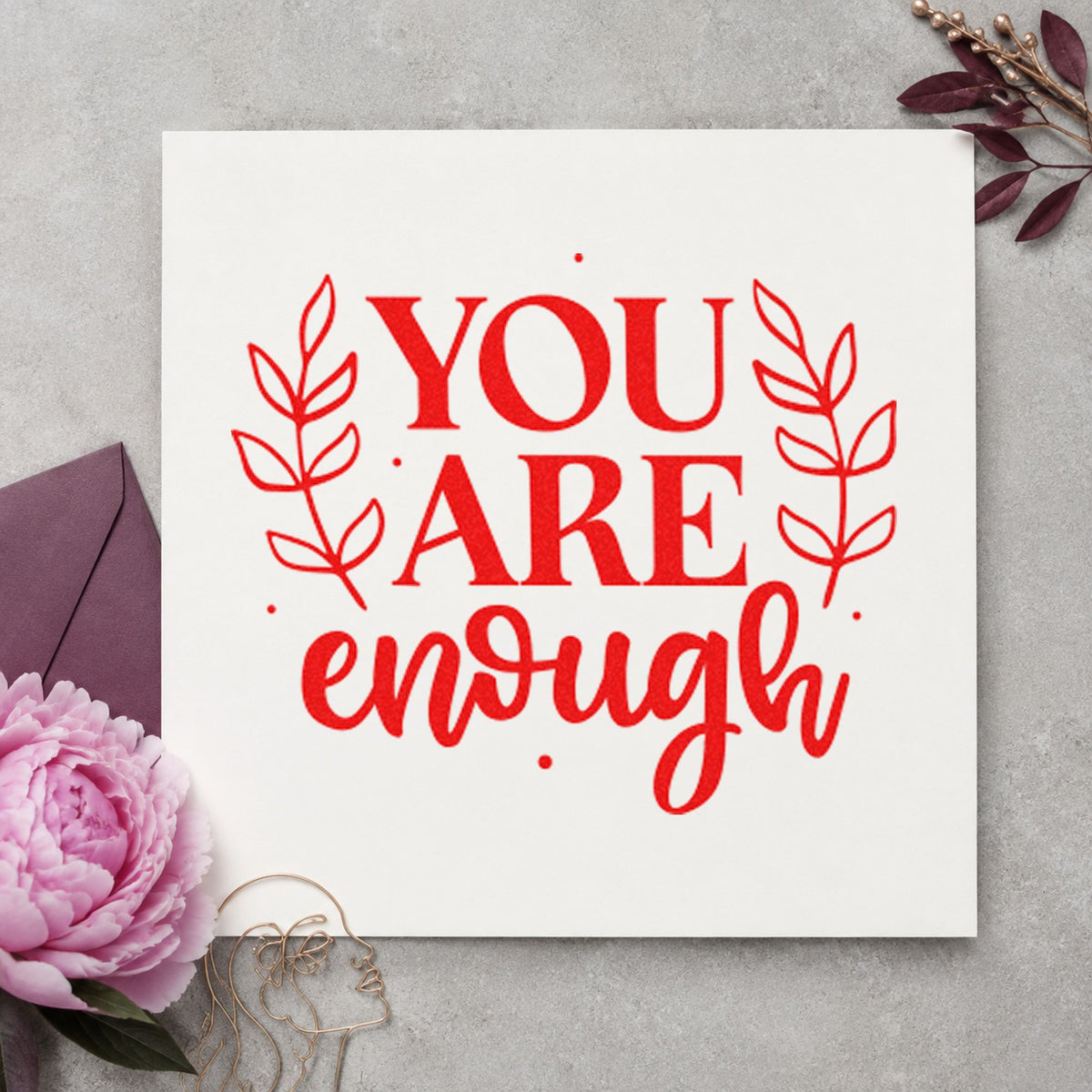 You Are Enough Leaves craft stamp imprint in red ink on a handmade project, one idea being wake note cards.