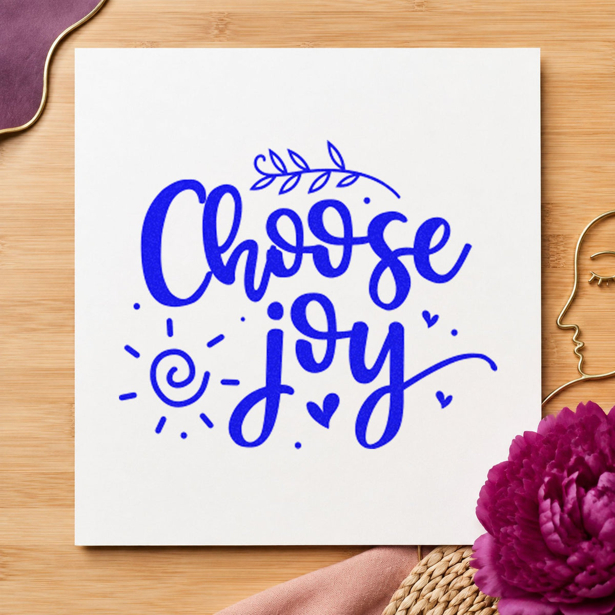 Choose Joy Leafy Script craft stamp imprinted in blue ink on paper, a design suited to framed class room.