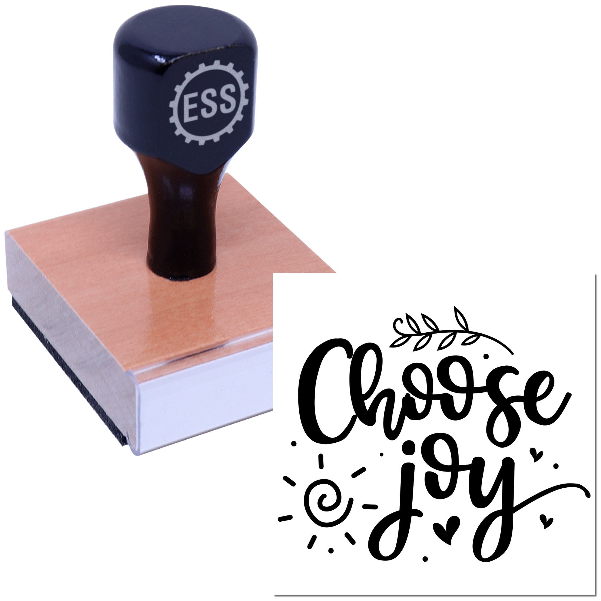 Black ESS rubber stamp seal on a wooden block with a white Choose Joy design preview.