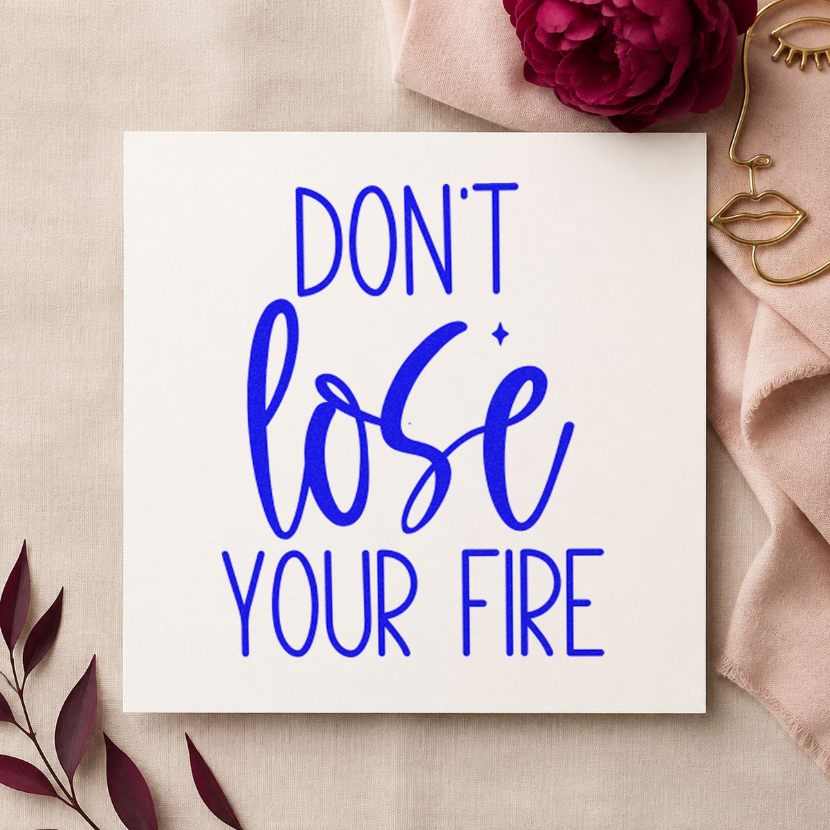 Do Not Lose Fire craft stamp in blue ink on cardstock, an easy option for forge apron printing.