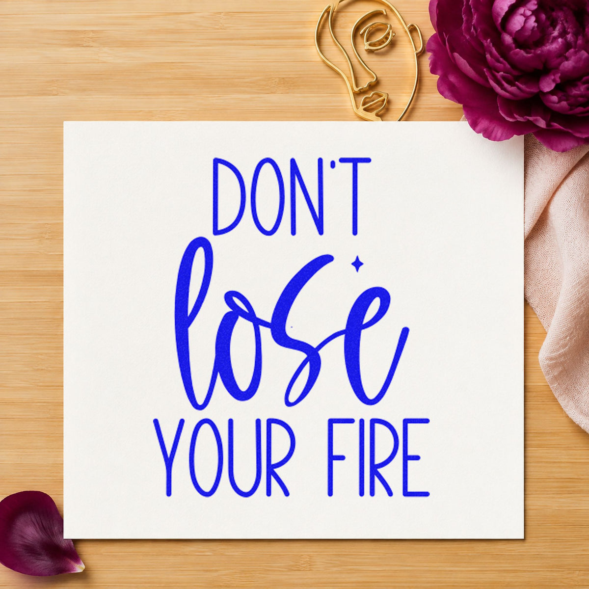 Do Not Lose Fire craft stamp imprinted in blue ink on paper, a design suited to framed forge wall.