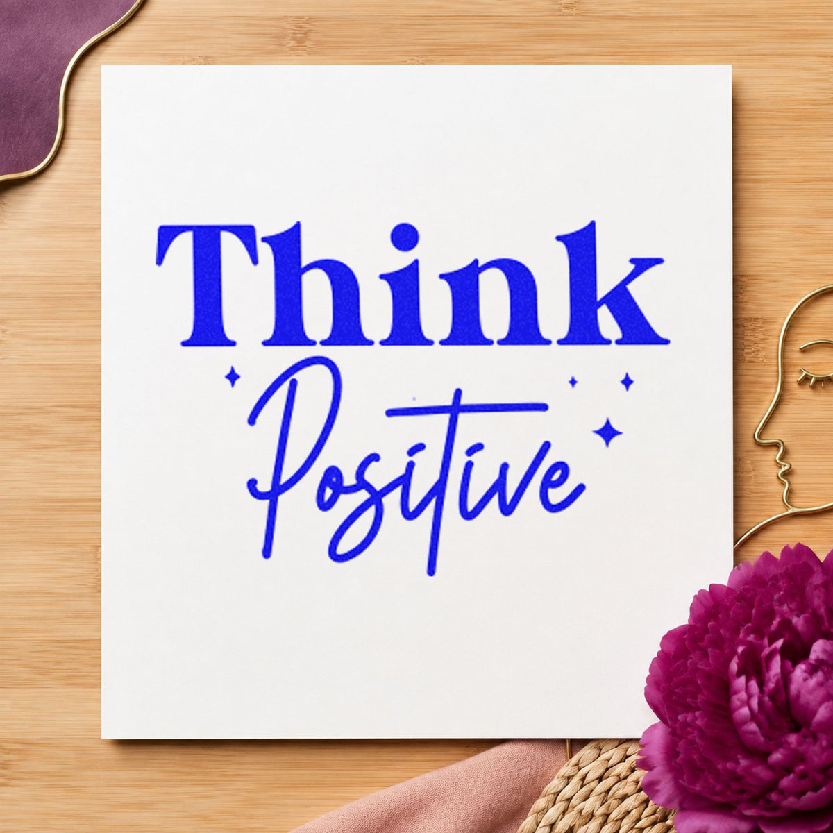 Think Positive Sparkle Lettering craft stamp imprinted in blue ink on paper, a design suited to framed reception wall.