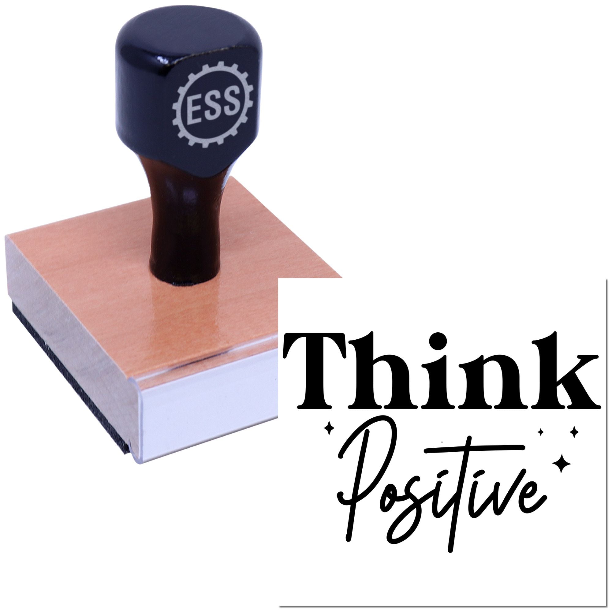 Dark navy ESS rubber stamp on pink wooden seal block with black Think Positive text.
