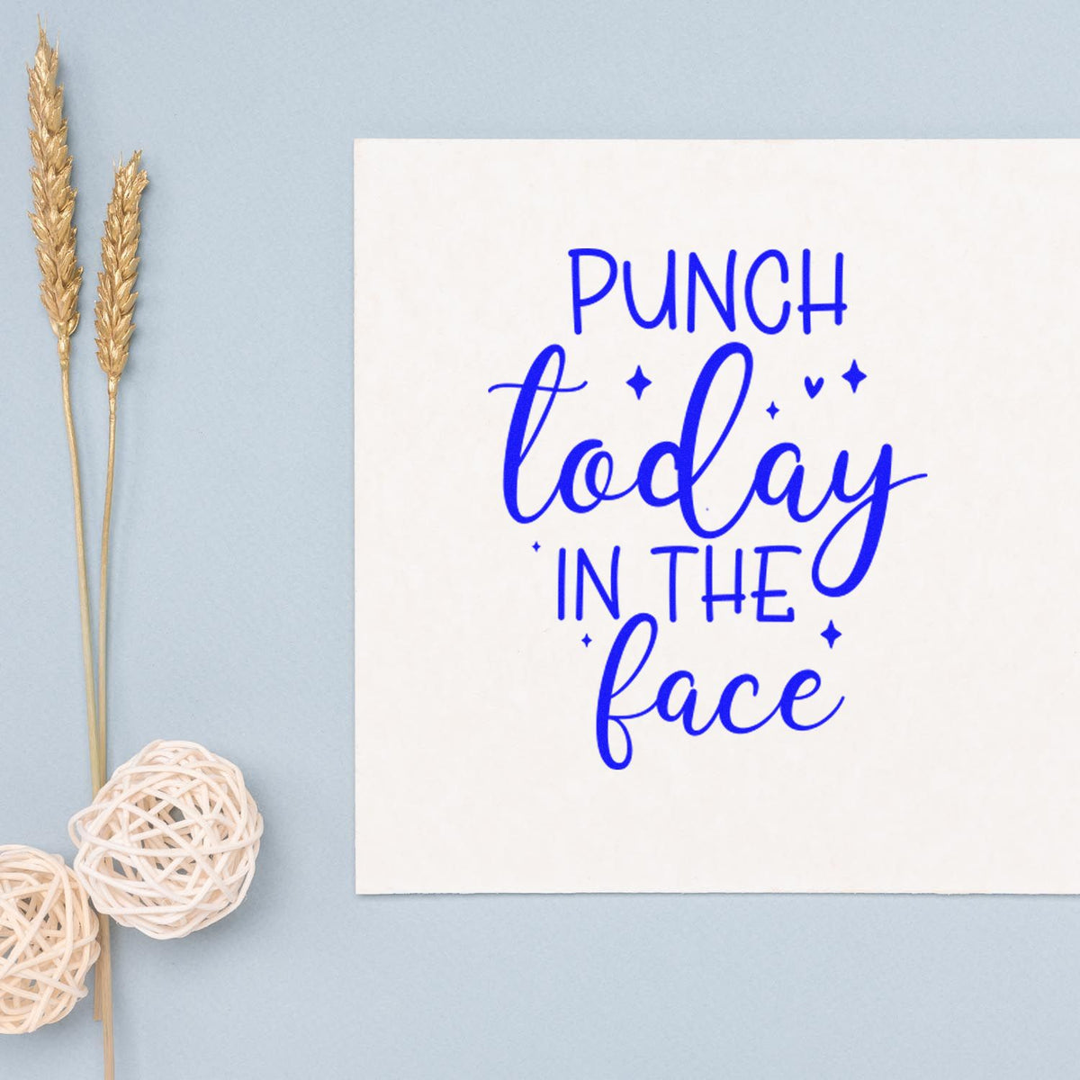 Blue Punch today in the face stamp and seal design on white card, with gold wheat stems and white woven accents.