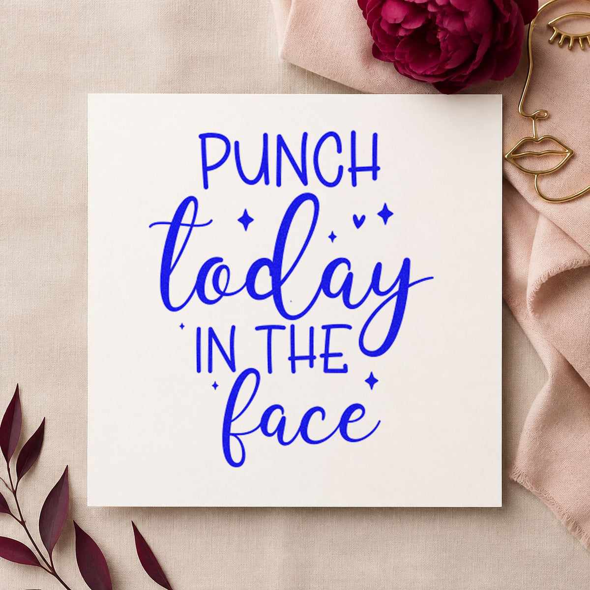 Punch Today In Face craft stamp imprinted in blue ink on paper, a design suited to framed break room.