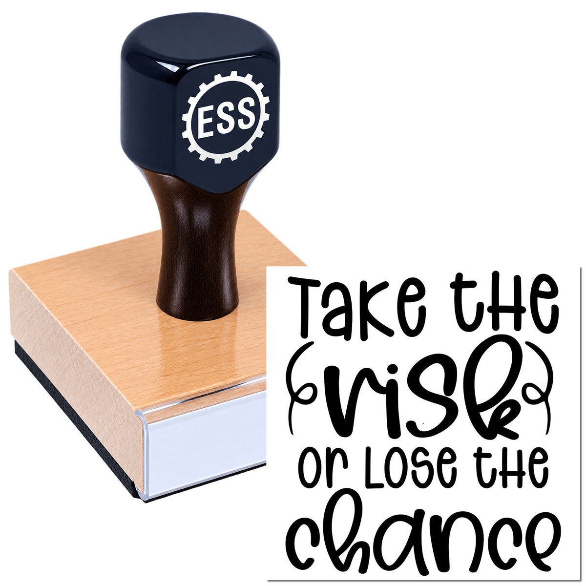 Dark blue ESS gear-logo rubber stamp on a pink seal block beside a quote plaque reading "Take the risk or lose the chance."