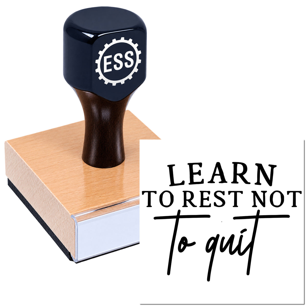 Black ESS stamp seal on a copper base beside a "Learn to rest not to quit" sign.