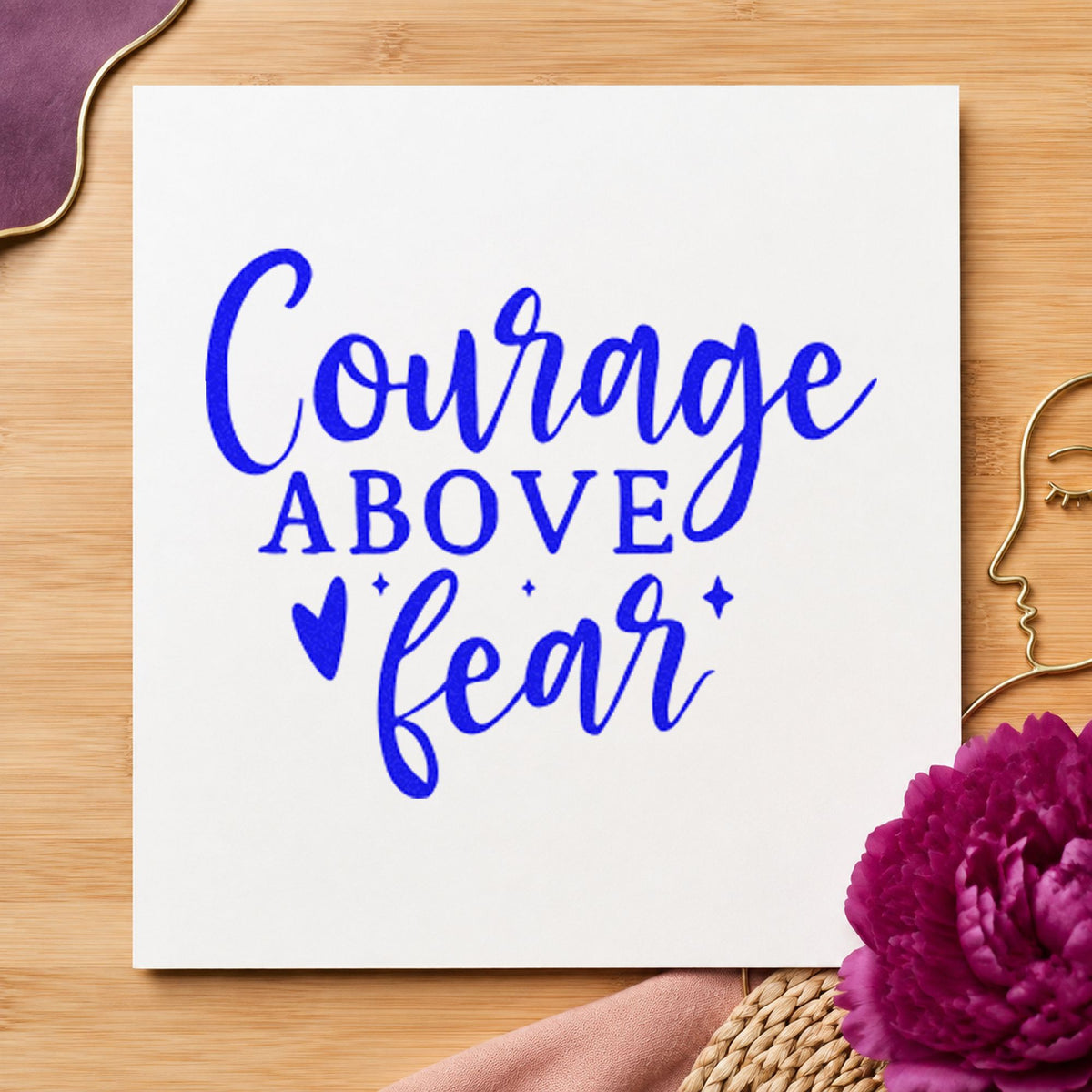 Courage Above Fear Heart craft stamp in blue ink on cardstock, an easy option for team jacket printing.