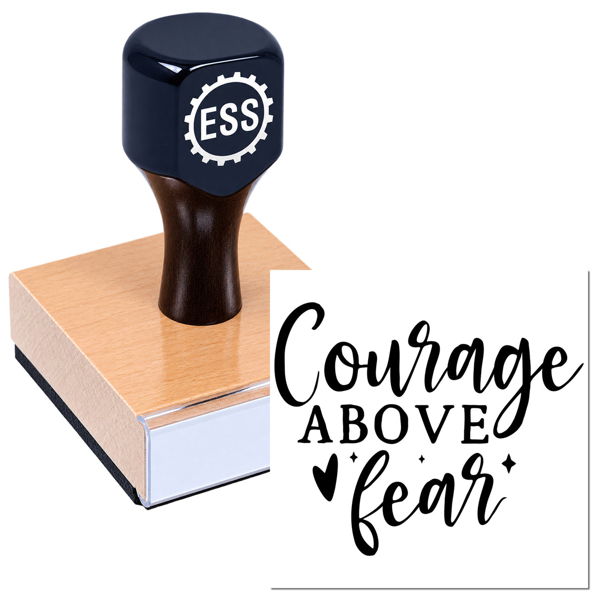 Navy custom stamp and seal on a pink block, with black "Courage Above Fear" lettering and a dark handle.