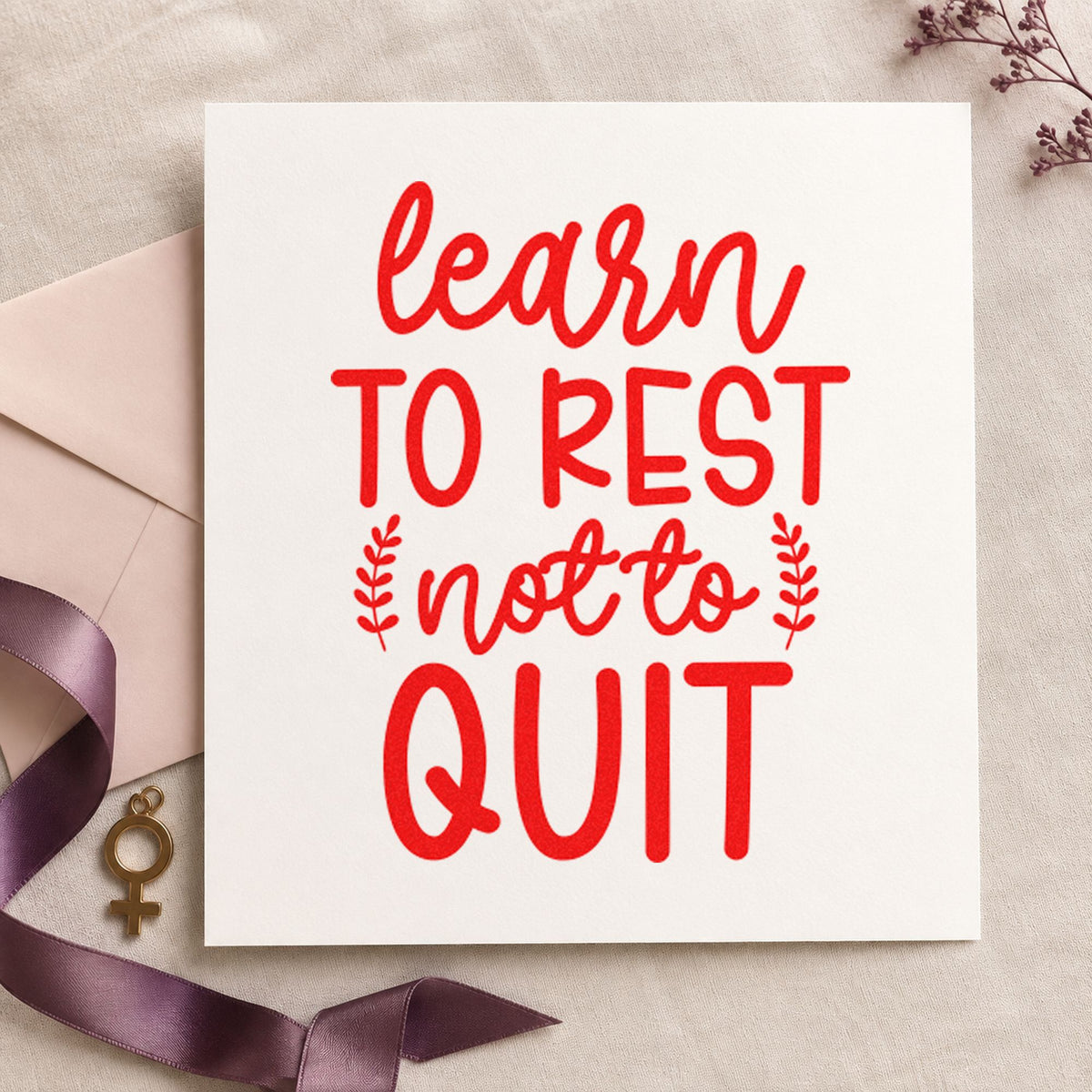Learn Rest Not Quit craft stamp imprint in red ink on a handmade project, one idea being plan note cards.