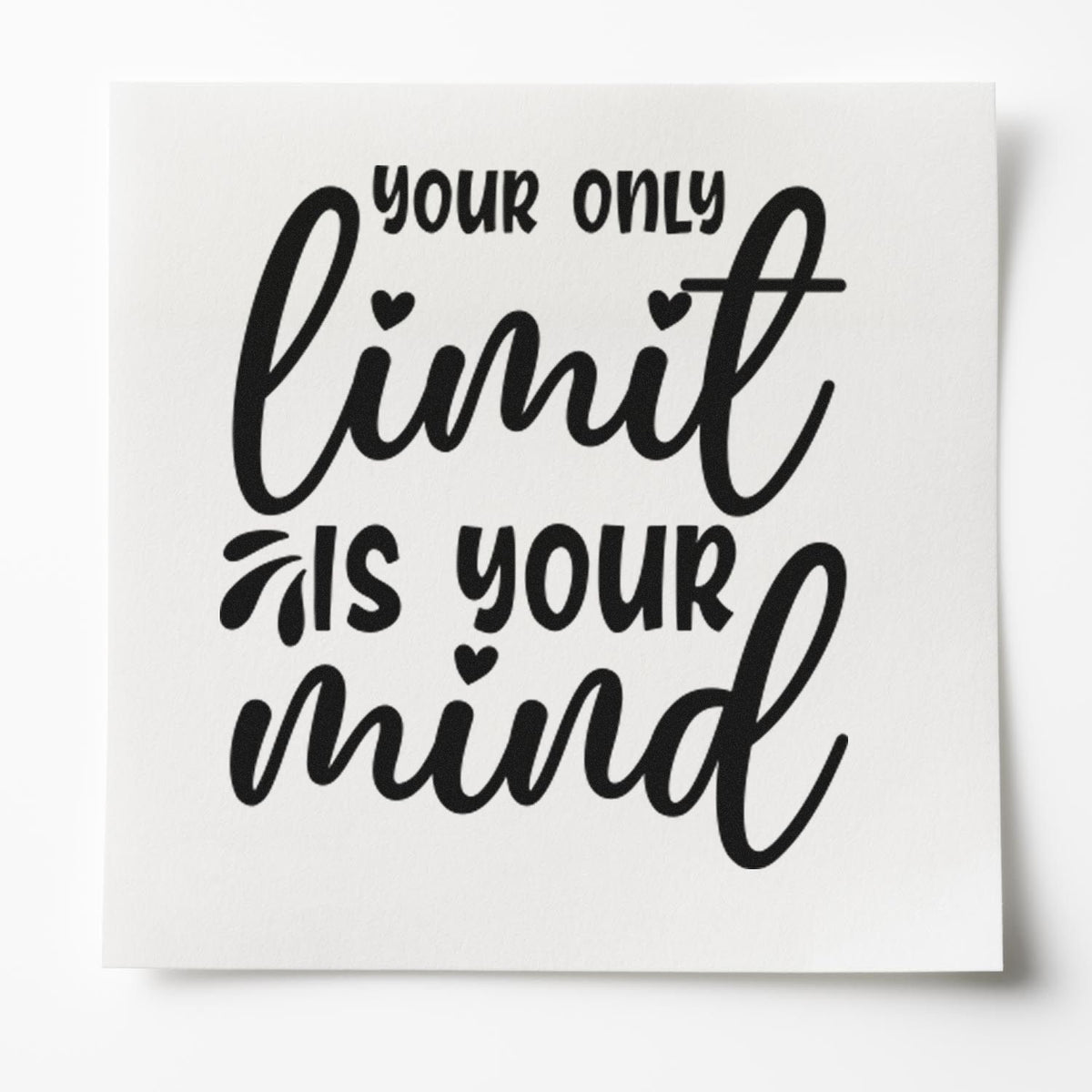 Black rubber stamp design reading your only limit is your mind on a white card with heart accents.