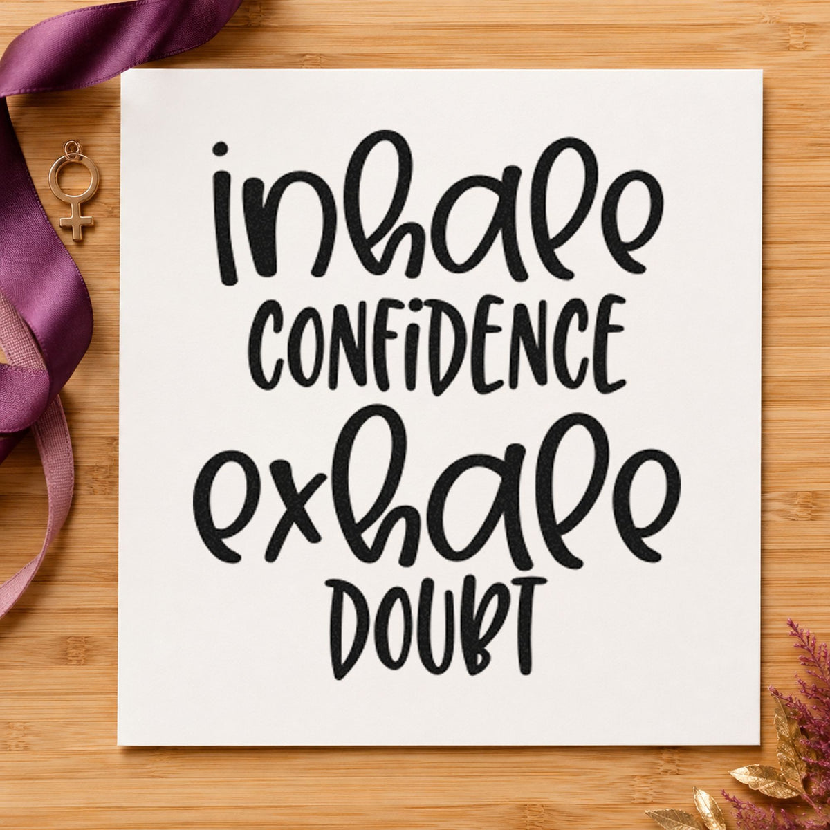 Inhale Confidence Exhale Doubt craft stamp imprint in black ink on a handmade project, one idea being chamois gift tags.