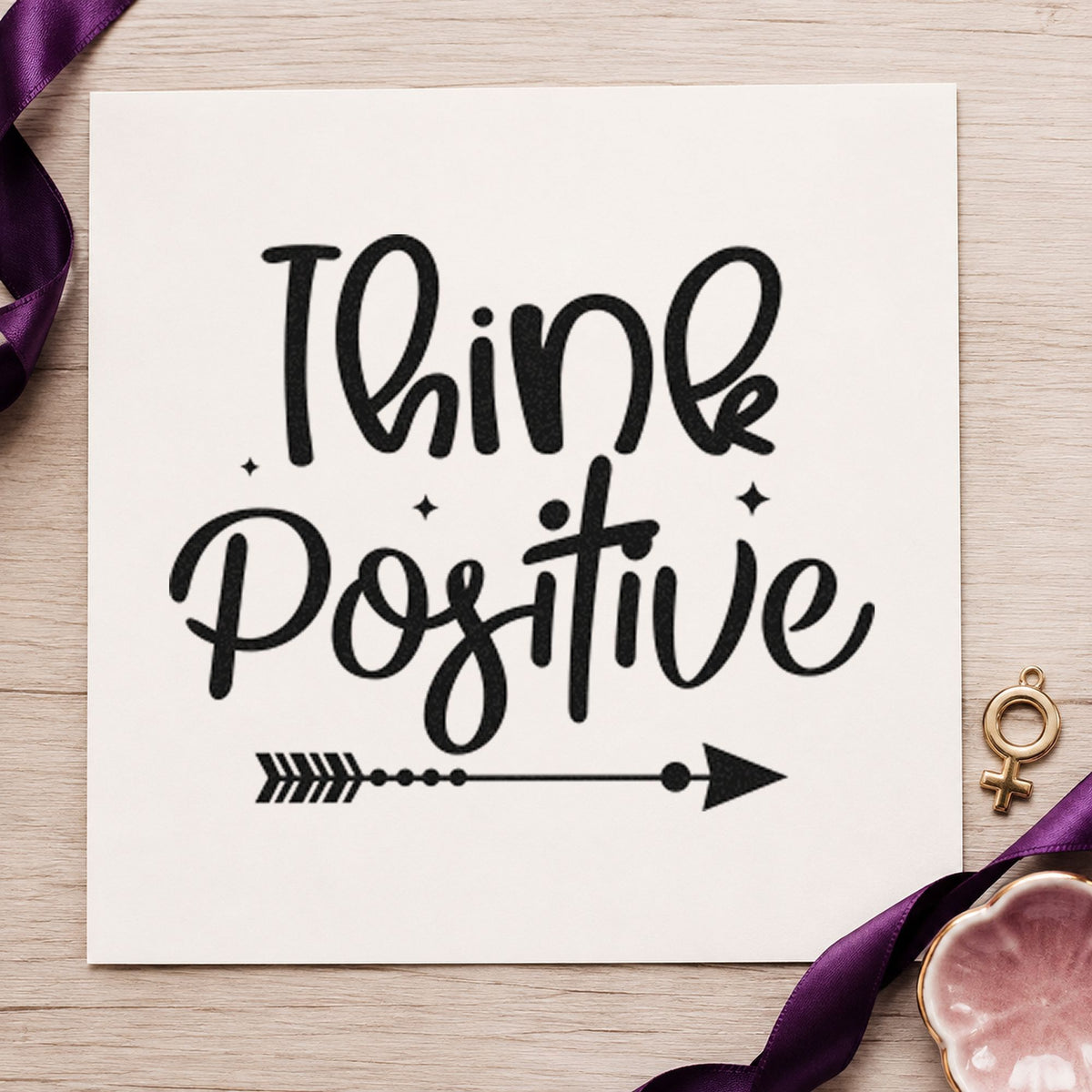 Think Positive Arrow Script craft stamp imprint in black ink on a handmade project, one idea being shoe bag gift tags.