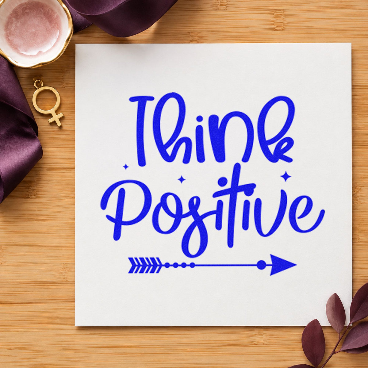 Think Positive Arrow Script craft stamp in blue ink on cardstock, an easy option for team shirt printing.