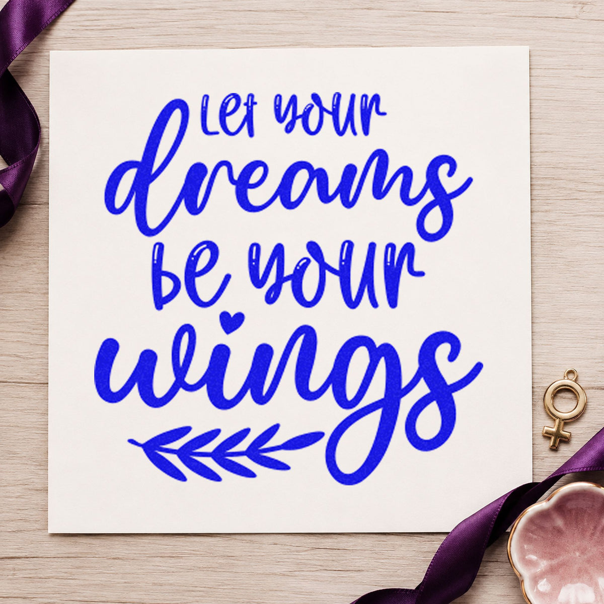 Dreams Wings Leafy Quote craft stamp imprinted in blue ink on paper, a design suited to framed loft door.
