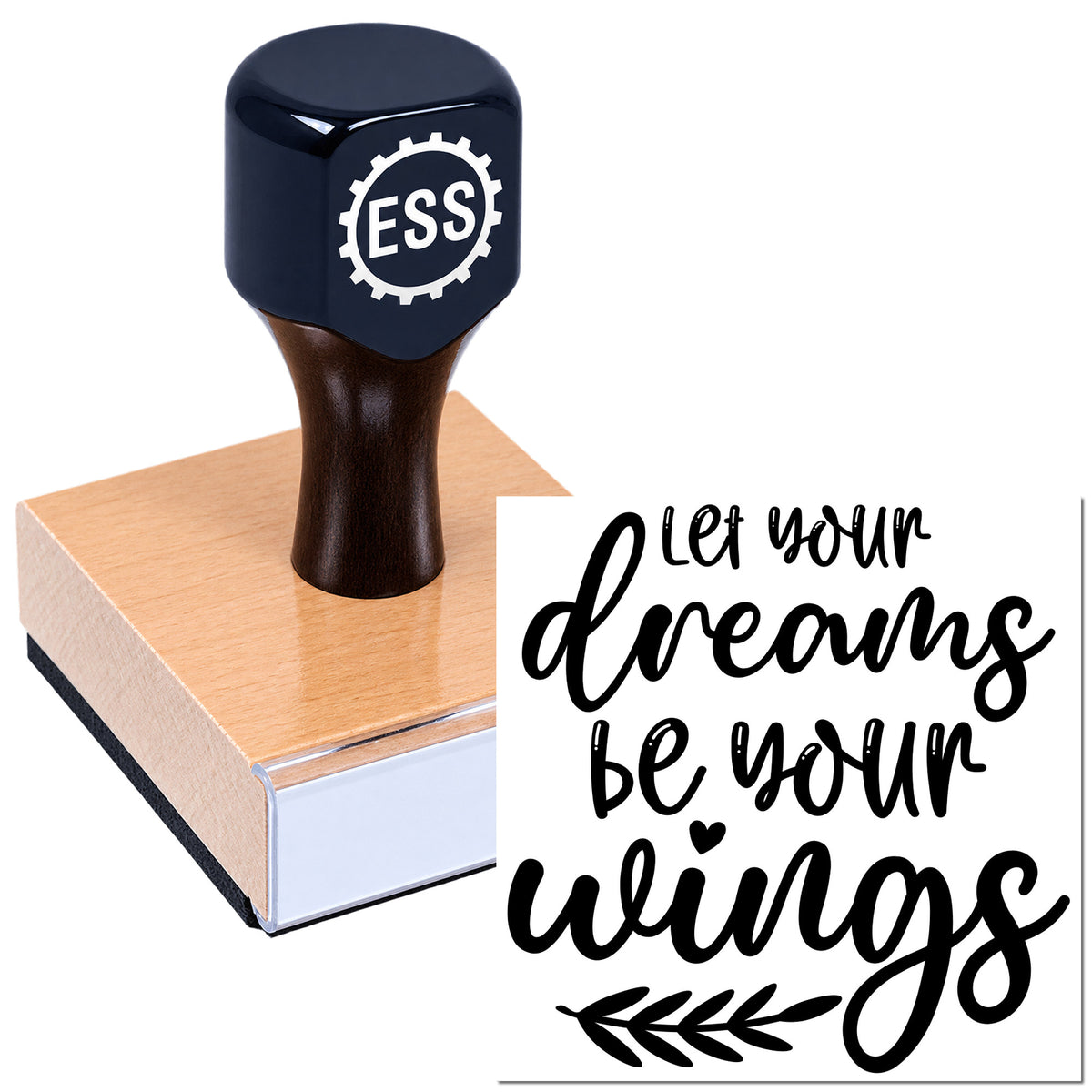 Navy ESS rubber stamp and seal on a rose gold block, with black script reading "Let your dreams be your wings."