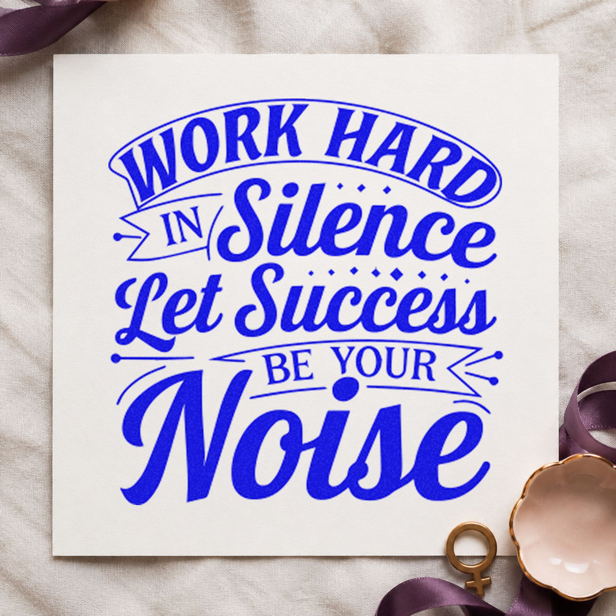 Work Hard In Silence craft stamp imprinted in blue ink on paper, a design suited to framed work window.