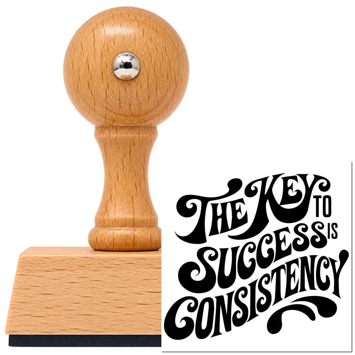 Vintage Pro beech wood stamp with a round knob handle, shown with its black Key To Success Consistency imprint on white.