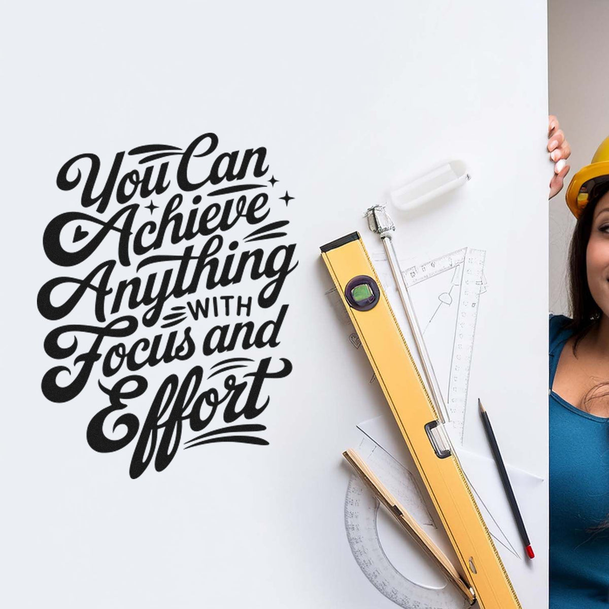 Custom black stamp seal reading "You Can Achieve Anything" on white board with yellow level, rulers, pencil, and drafting tools.