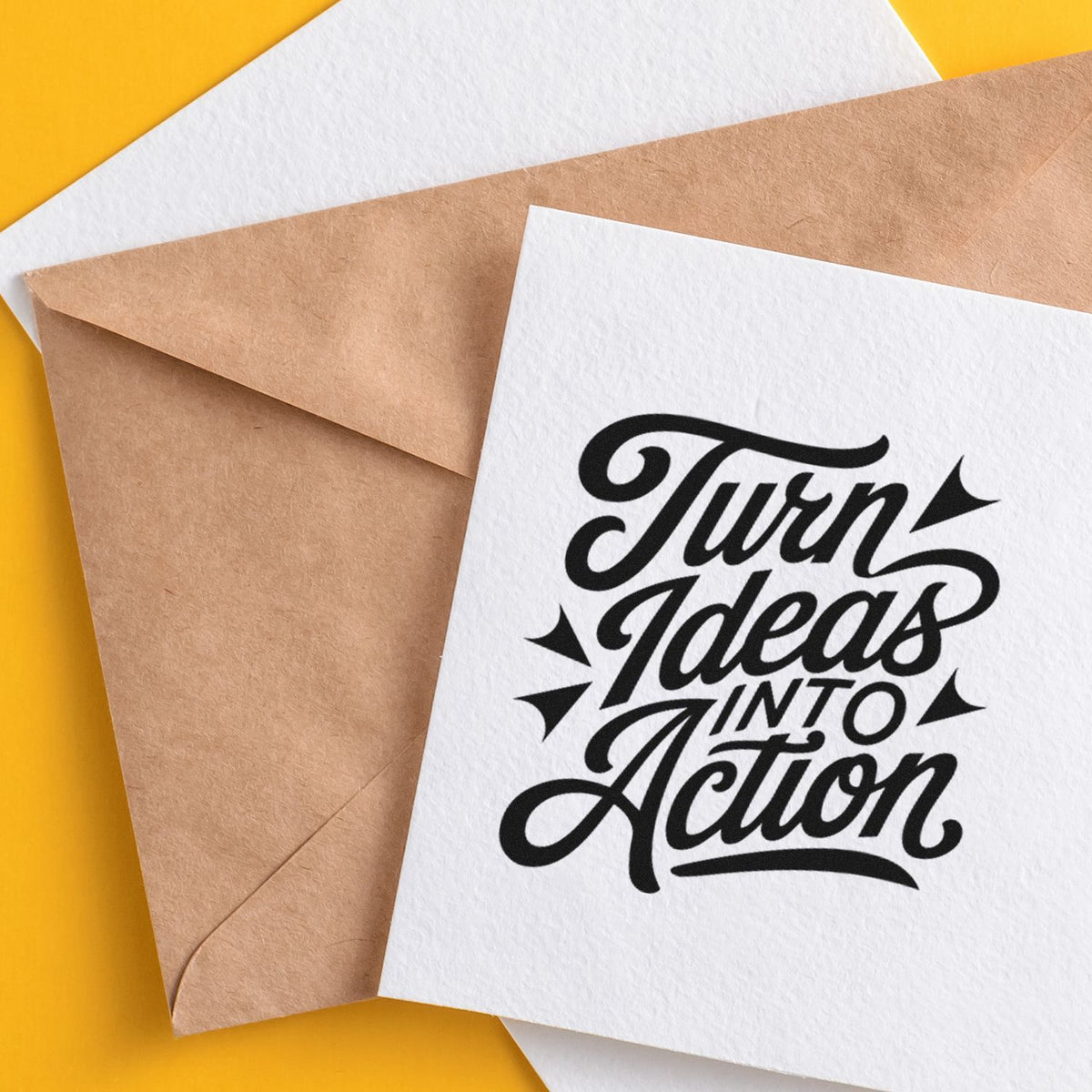 Kraft envelopes and white stamp cards on yellow background with bold black Turn Ideas Into Action seal design.
