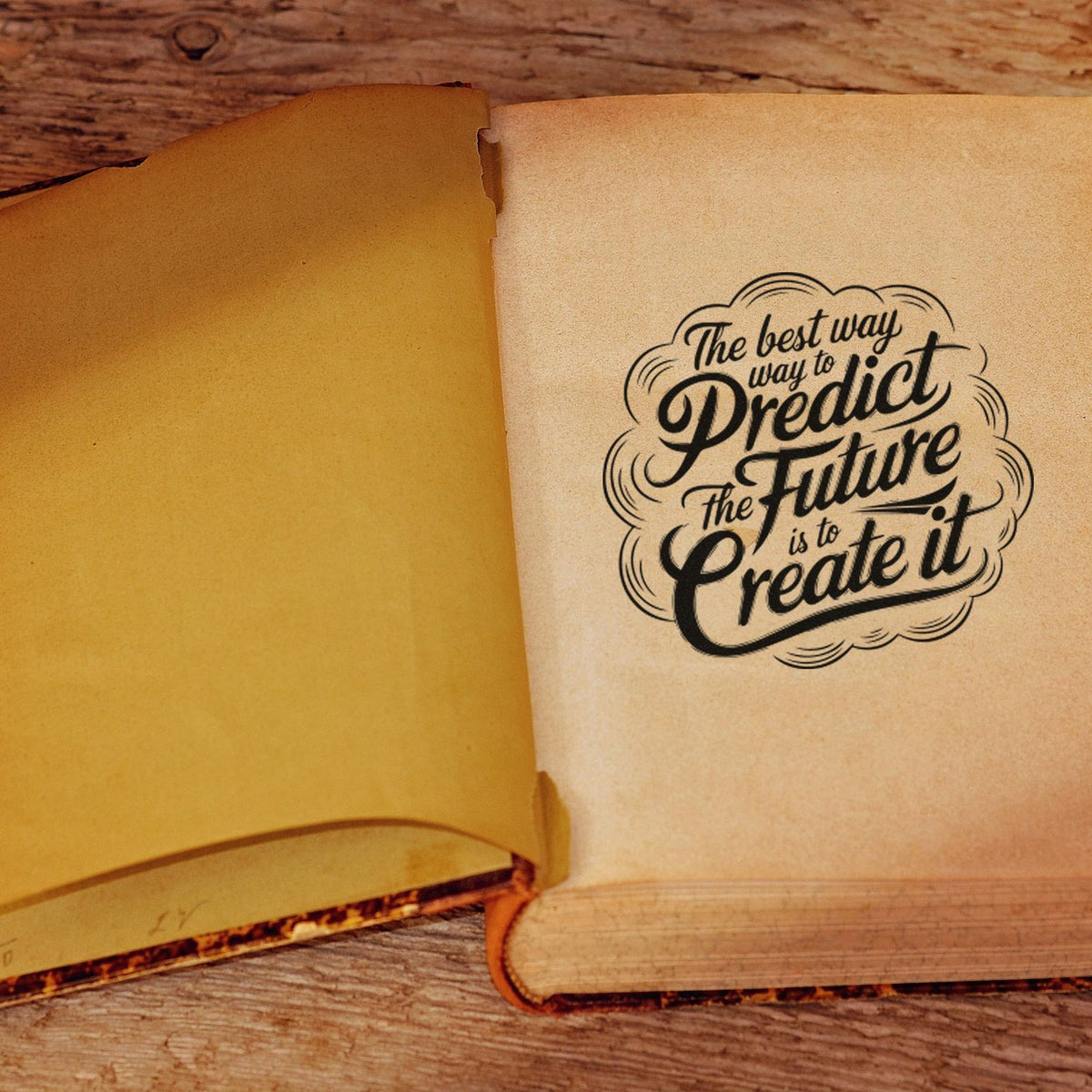 Black typographic stamp seal on an open tan book page over rustic wood, reading Predict the future is to create it.