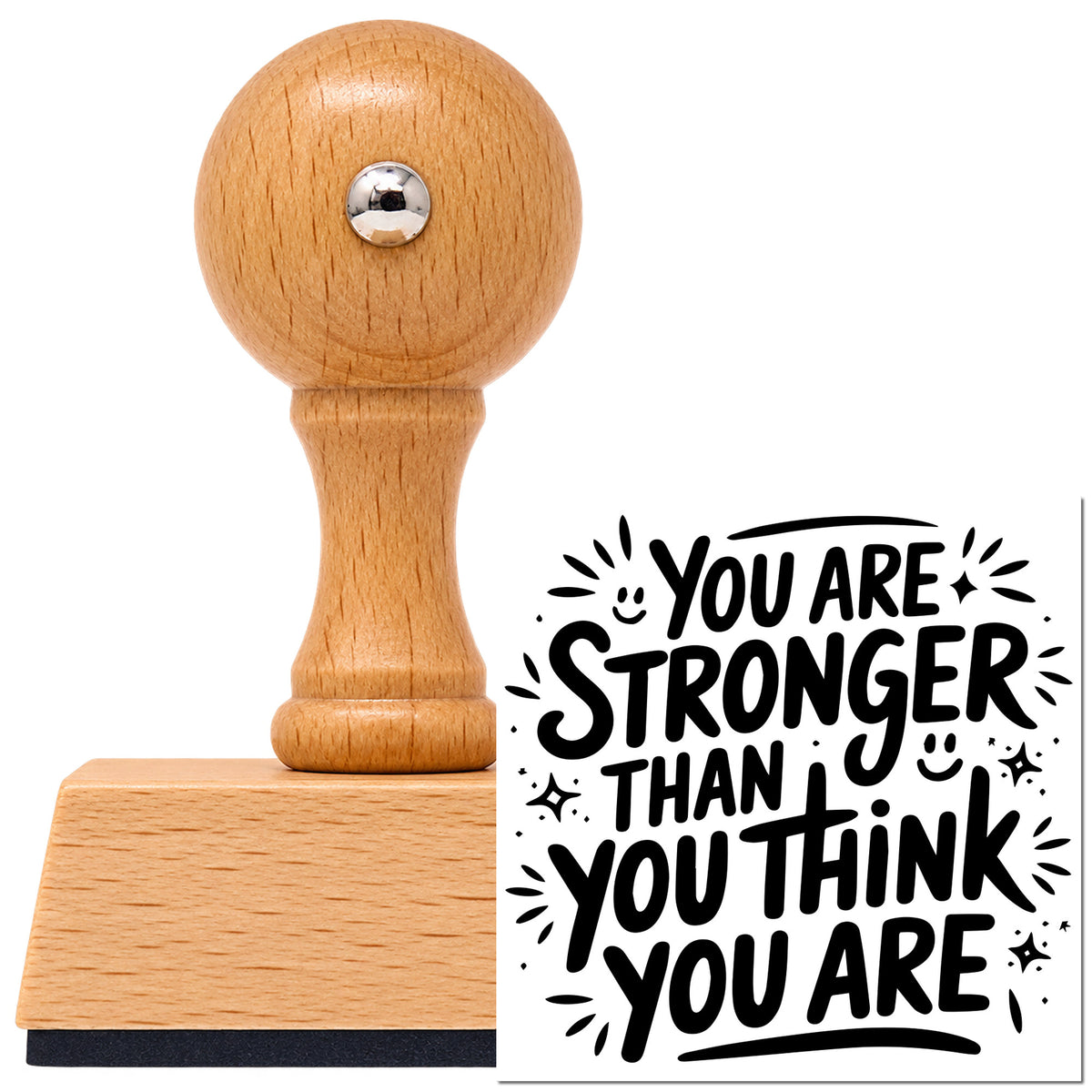 Vintage Pro beech wood stamp with a round knob handle, shown with its black Stronger Than You Think imprint on white.