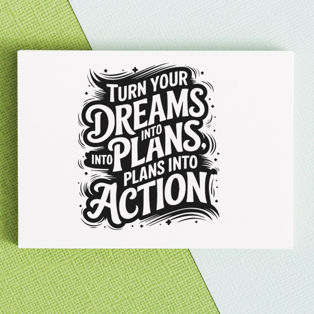 Black-and-white motivational stamp seal reading "Turn your dreams into plans, plans into action" on white card with green background.