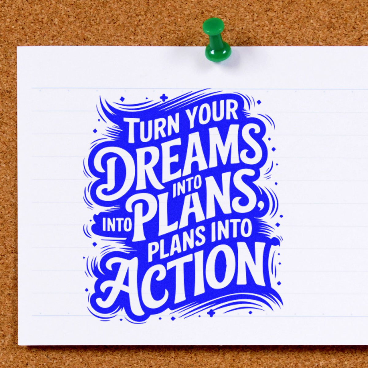 Blue motivational stamp/seal on white paper pinned with a green pushpin: Turn your dreams into plans into action.