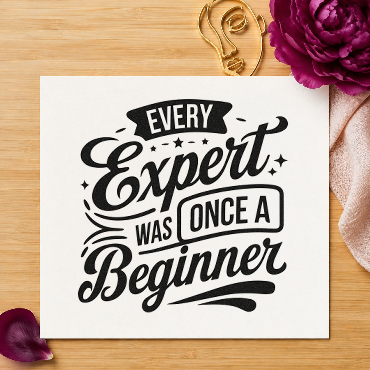 Every Expert Once Beginner craft stamp imprint in black ink on a handmade project, one idea being apron gift tags.