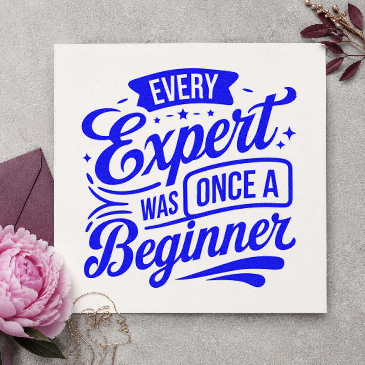 Every Expert Once Beginner craft stamp in blue ink on cardstock, an easy option for student apron printing.