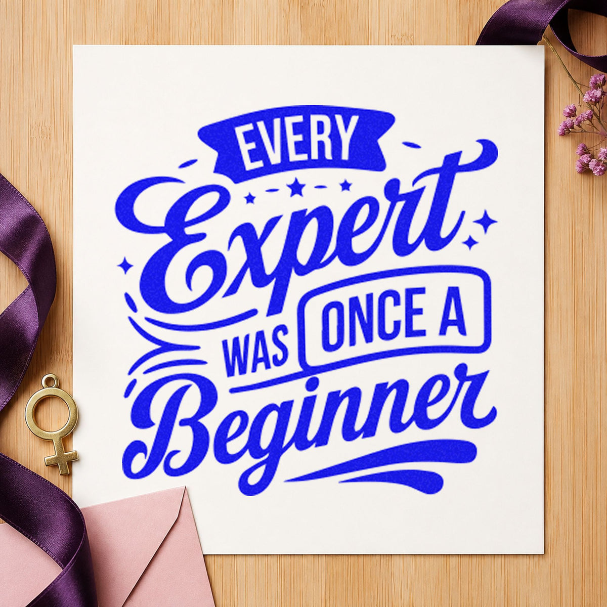 Every Expert Once Beginner craft stamp imprinted in blue ink on paper, a design suited to framed demo kitchen.