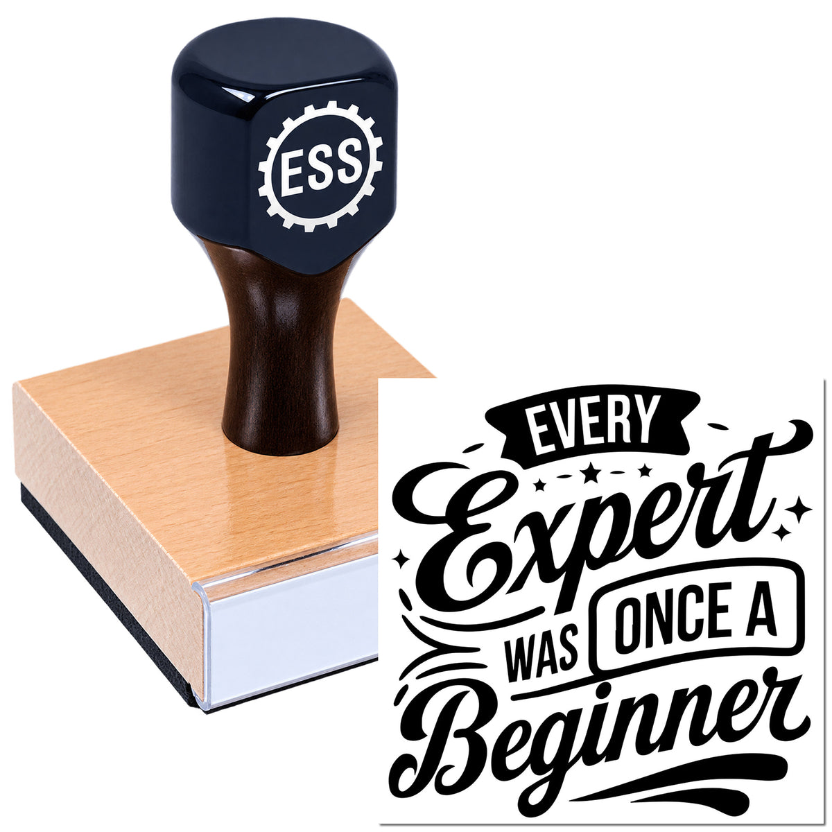 Dark blue ESS stamp and black "Every Expert Was Once A Beginner" seal design on a wooden block.