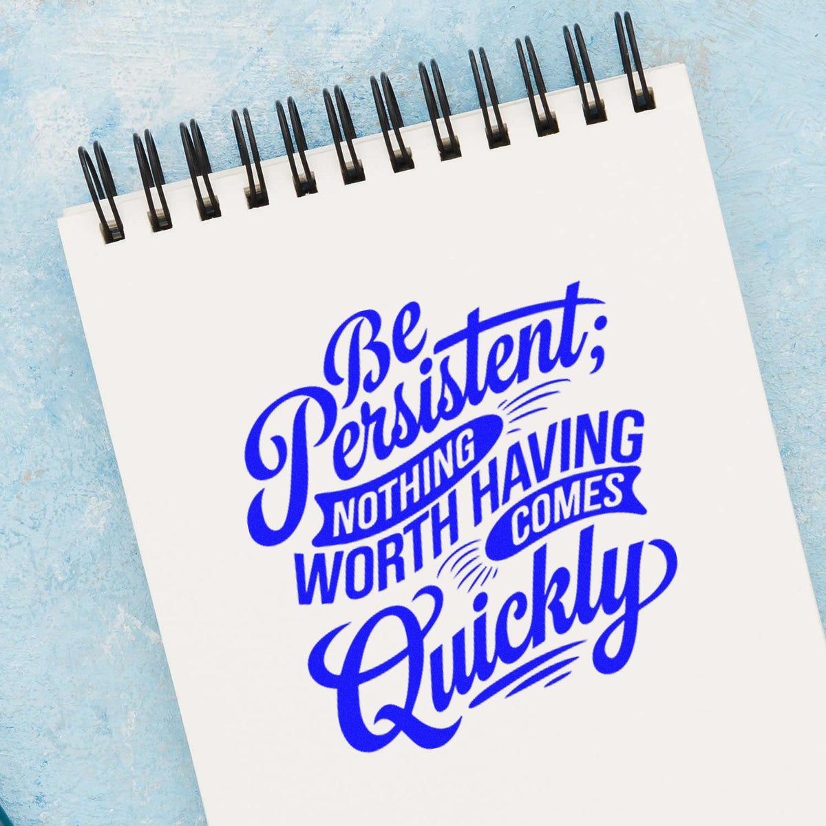 Be Persistent Nothing Quickly rubber stamp shown in blue ink, stamped for projects such as restore album page.