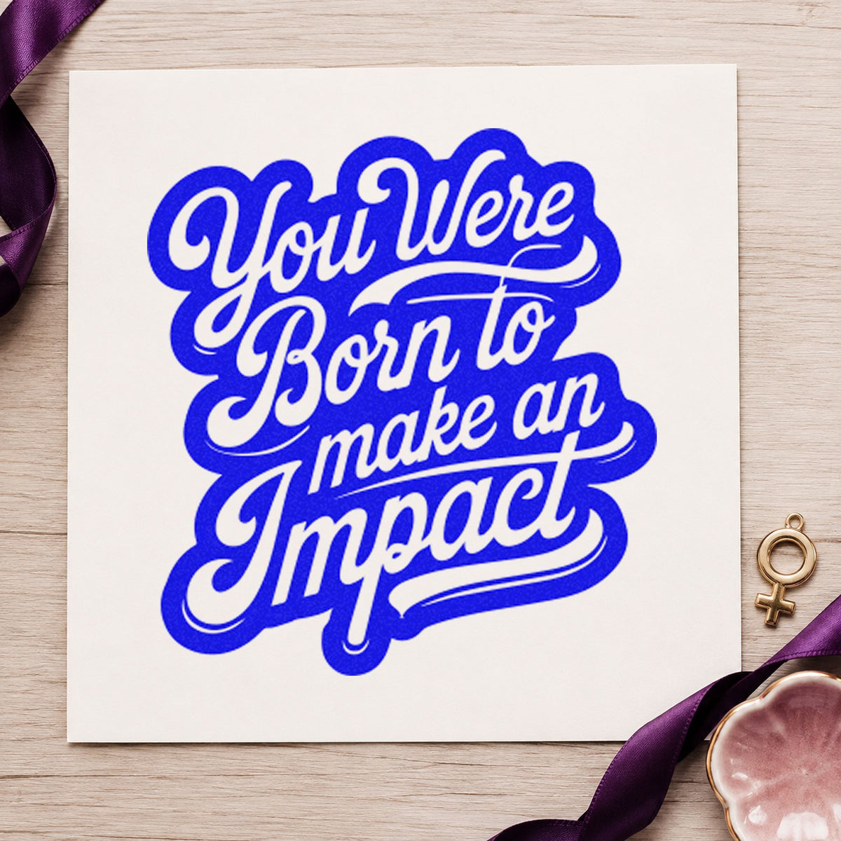 Born To Make Impact craft stamp in blue ink on cardstock, an easy option for volunteer sash printing.