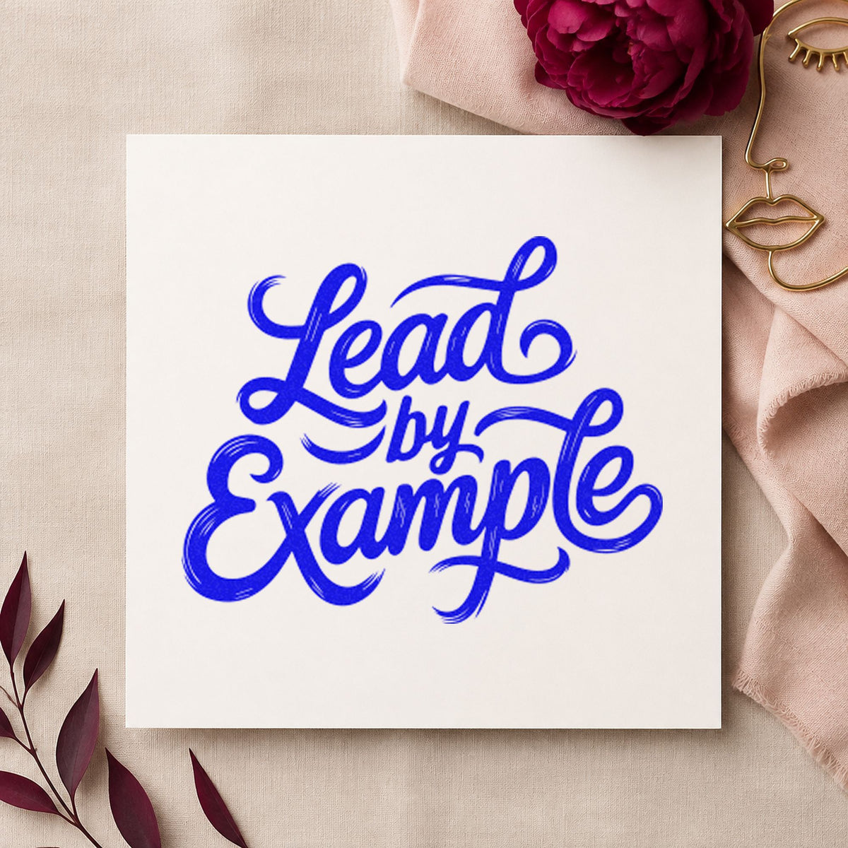 Lead By Example Script craft stamp in blue ink on cardstock, an easy option for pit mat printing.