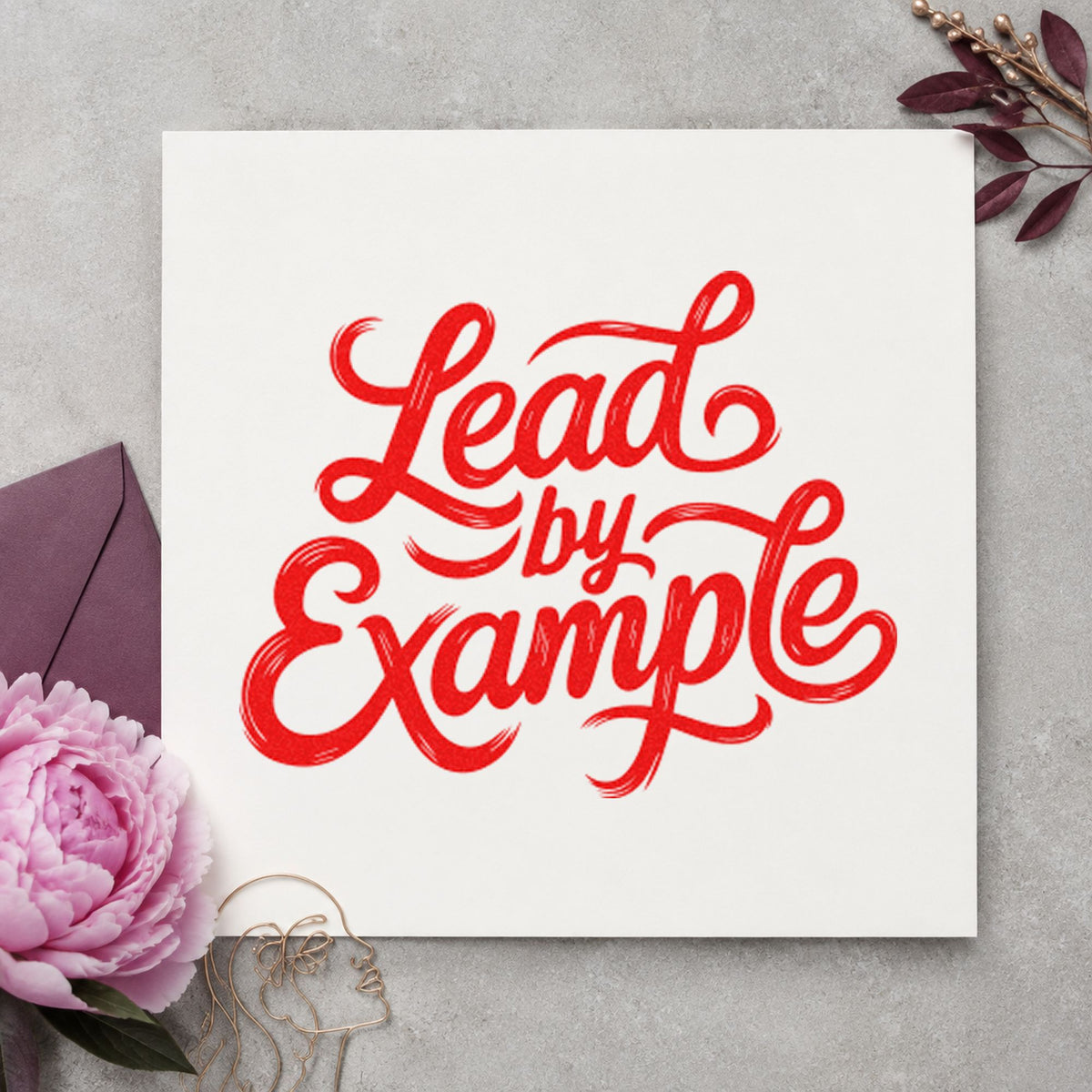 Lead By Example Script craft stamp imprint in red ink on a handmade project, one idea being stop role cards.