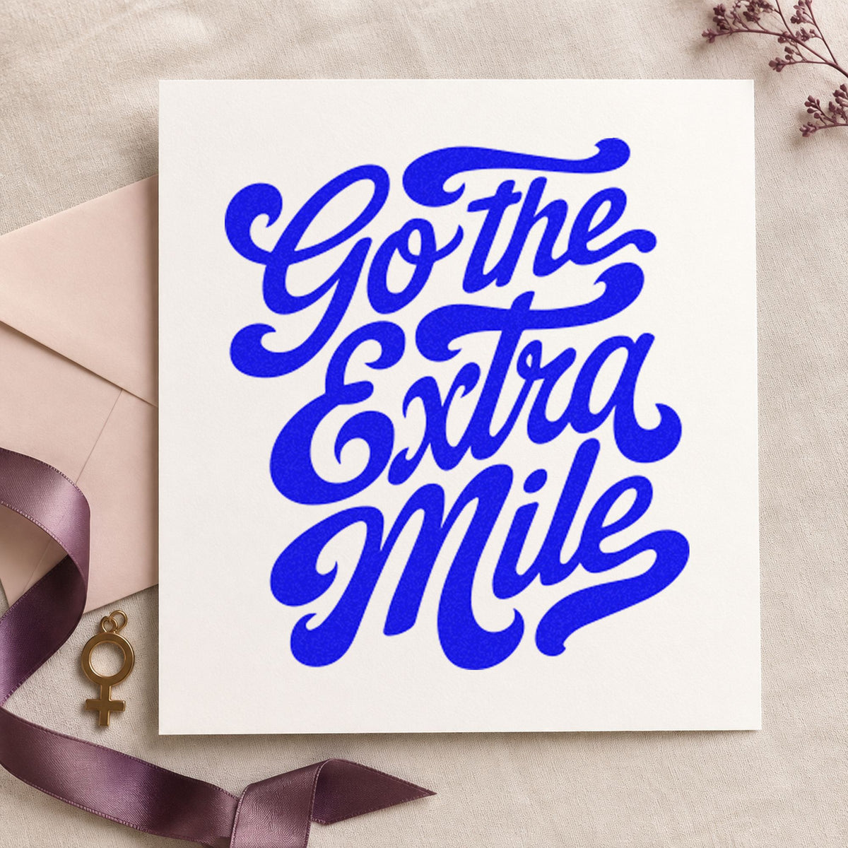 Go The Extra Mile craft stamp in blue ink on cardstock, an easy option for messenger bag printing.