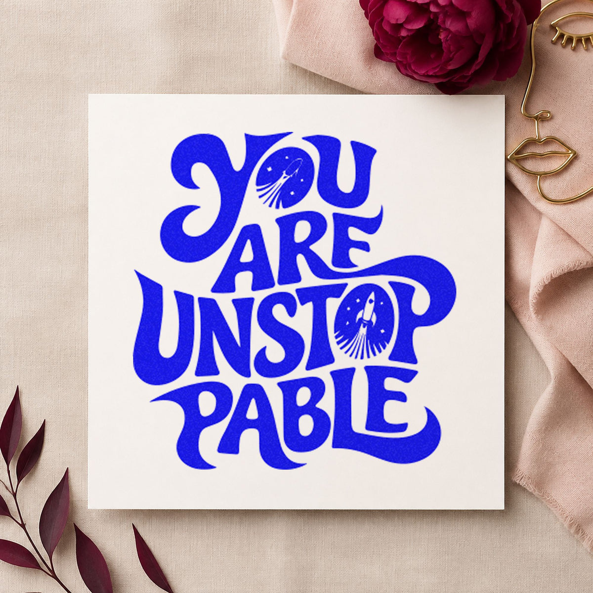 You Are Unstoppable Lettering craft stamp imprinted in blue ink on paper, a design suited to framed dressing room.