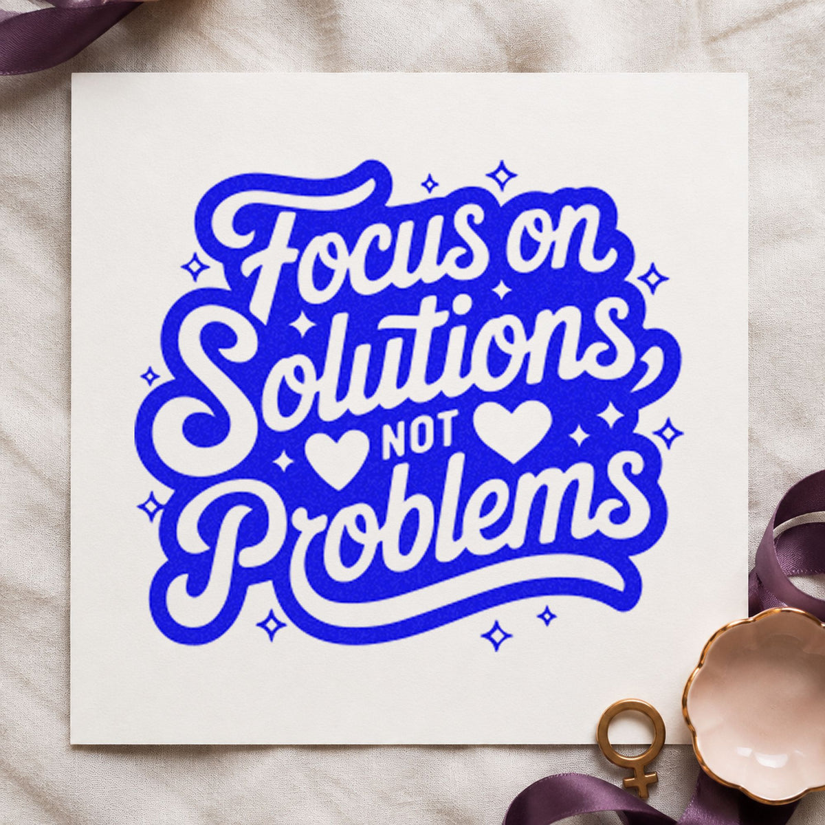 Focus Solutions Not Problems craft stamp imprinted in blue ink on paper, a design suited to framed desk wall.