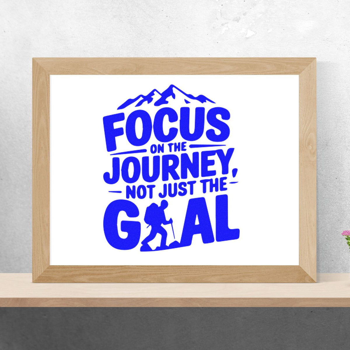 Blue mountain hiking stamp/seal design with quote Focus on the journey, not just the goal in a light wood frame.