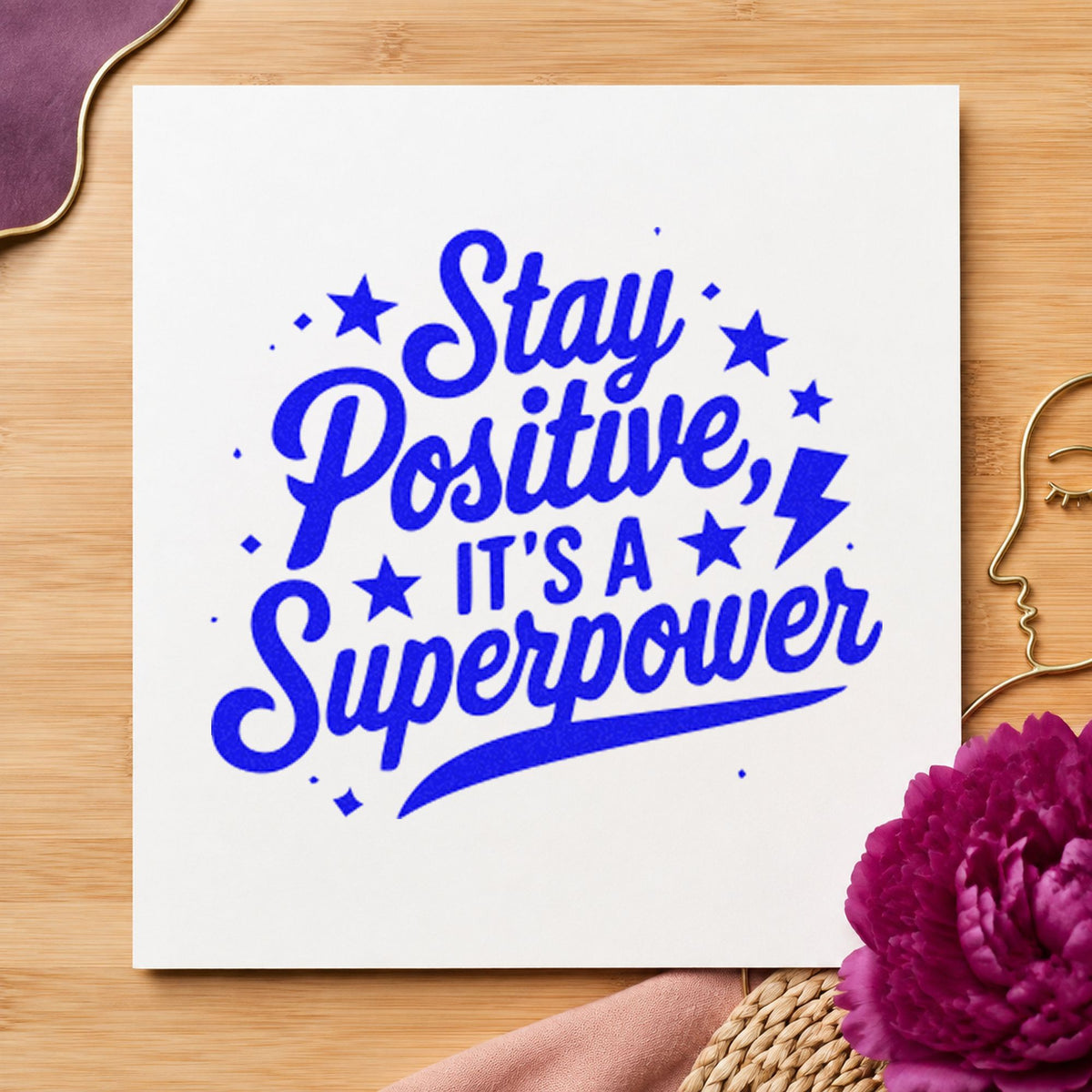 Stay Positive Superpower Stars craft stamp imprinted in blue ink on paper, a design suited to framed club room.